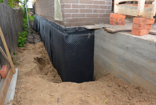 Happy homeowners after waterproofing job in Westmoreland